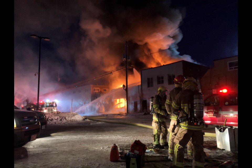 Fire spreads to second building